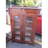 A 19th century French mahogany two door glazed bookcase with single drawer above and three fitted