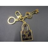 A modern Louis Vuitton Confidence, key ring/handbag charm, serial number OB0171