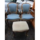 A pair of mid 20th century French walnut framed armchairs, together with a stool