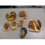 A selection of chalkware wall hanging faces to include Bossons