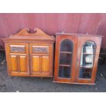 Two Victorian mahogany small wall hanging cabinets to include one having a broken swan neck pediment