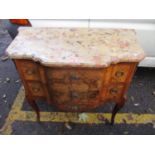 A reproduction French burr walnut fronted two drawer commode having a marble top, applied metal