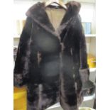 A vintage faux fur ladies' three-quarter length coat in brown, together with a matching hat