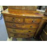 A Victorian mahogany bow fronted chest of two short and three long drawers, bun handles on turned