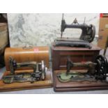 Three sewing machines to include a Victorian example with marquetry inlaid case, a Singer and a W