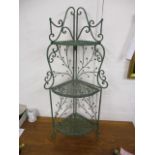 A green painted wrought and cast metal three tier corner stand with floral ornament 46"H x 18"W