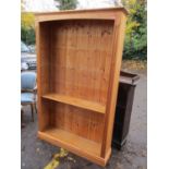 A modern pine large bookcase on a plinth base 78"h x 49 1/2"w