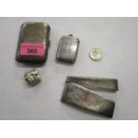 A silver card case, cigarette holder, a vesta case with engraved monogramme, a small pill box with