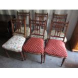 A set of six late Victorian walnut dining chairs standing on turned front legs