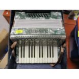 An Alvari piano accordion in a carrying case