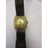 A mid 20th century gold coloured metal gents' wristwatch with a leather strap