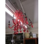 A modern red glass chandelier