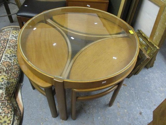 A mid 20th century Nathan teak framed Trinity coffee table with a glass top with three ellipse