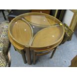 A mid 20th century Nathan teak framed Trinity coffee table with a glass top with three ellipse