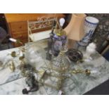 A mixed lot to include wall lights, a crystal drop chandelier, table lamps and other items