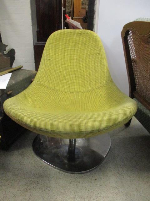 A modern 1960s style swivel chair