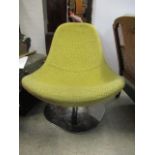 A modern 1960s style swivel chair