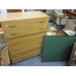 A mid 20th century teak chest of six long drawers, together with a folding card and a telephone