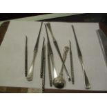 A Victorian silver Kings pattern mustard spoon, four Sorensen silver handled lobster picks and