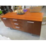 A Stewart Linford cherrywood finished sideboard with two doors and three drawers