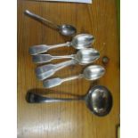 Five silver fiddle pattern teaspoons and a silver sauce ladle and a silver teaspoon