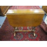 A late Victorian walnut Sutherland table on ring turned legs