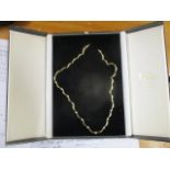 A 9ct gold necklace set with thirteen diamonds boxed 17.5g