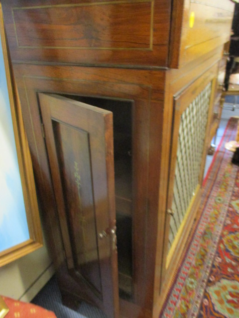 An early 20th century walnut chiffoniere having side doors and one central door below a single - Image 2 of 5