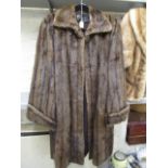 A three-quarter length ladies' mink coat