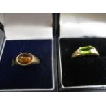 A 9ct gold ring set with a green stone and a yellow metal ring stamped 375