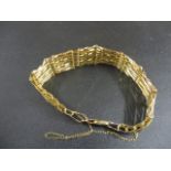 A gold coloured multi-link bracelet stamped 375 10.9g