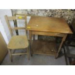 An early 20th century oak occasional table having a hinged lid and barley twist supports, together