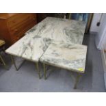 A large marble topped, square coffee table on a brass base, 17" h x 41" w and two smaller matching