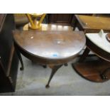 A mid 20th century walnut, demi lune tea table, on cabriole legs, 29" h, 32"w