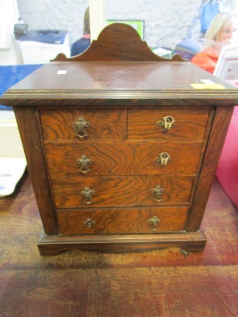 An late Victorian/early 20th century miniature chest of two short and three long drawers,