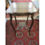 A mahogany two tier occasional table