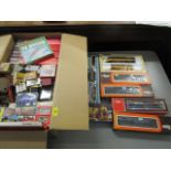 A quantity of H0 gauge model railway boxed sets, carriages, rolling stock and accessories to include