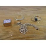 Two 9ct gold rings and a fine chain and a charm with a ten shilling banknote