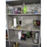 A large selection of glassware to include decanters, wine glasses, vases and other items