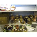 A selection of metalware to include copper jugs, a purdonium and other items