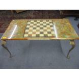 A retro onyx topped chess/coffee table on gilt metal base 16 1/4" x 35 1/4" x 17 3/4"