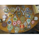 A collection of vintage enamelled metal car badges to include The Order of the Road 65 year driver