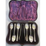 An early 20th century cased set of six silver teaspoons and sugar tongs