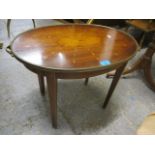 An Edwardian Sheraton revival oval occasional table on four tapering legs, 18" h x 25 1/2"w