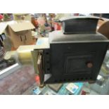 A late Victorian/early 20th century brass and tin cased magic lantern