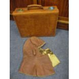 A mid 20th century small leather suitcase and a fur lined leather flying jacket