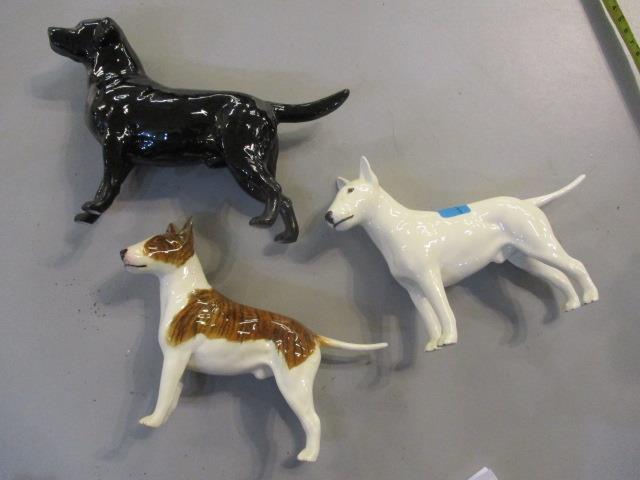 Three Beswick models of dogs to include a Labrador together with a Beswick model of a horse