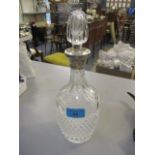 A silver collared, cut glass decanter, 12"h