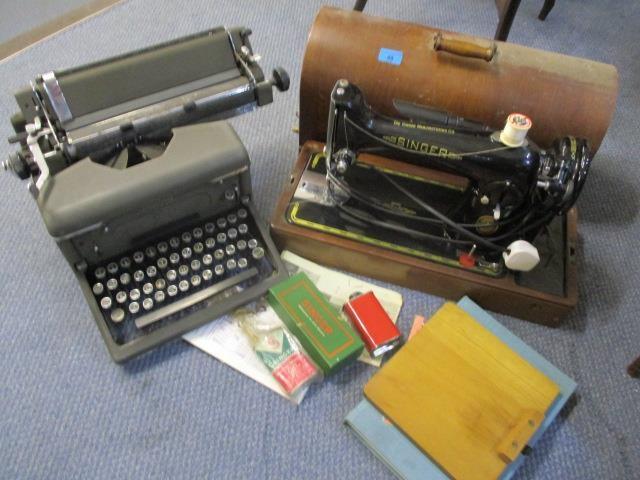 A Singer sewing machine together with an Imperial typewriter and accessories
