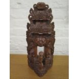 An Asian carved wooden altar ornament, possibly Indonesian 15" high
